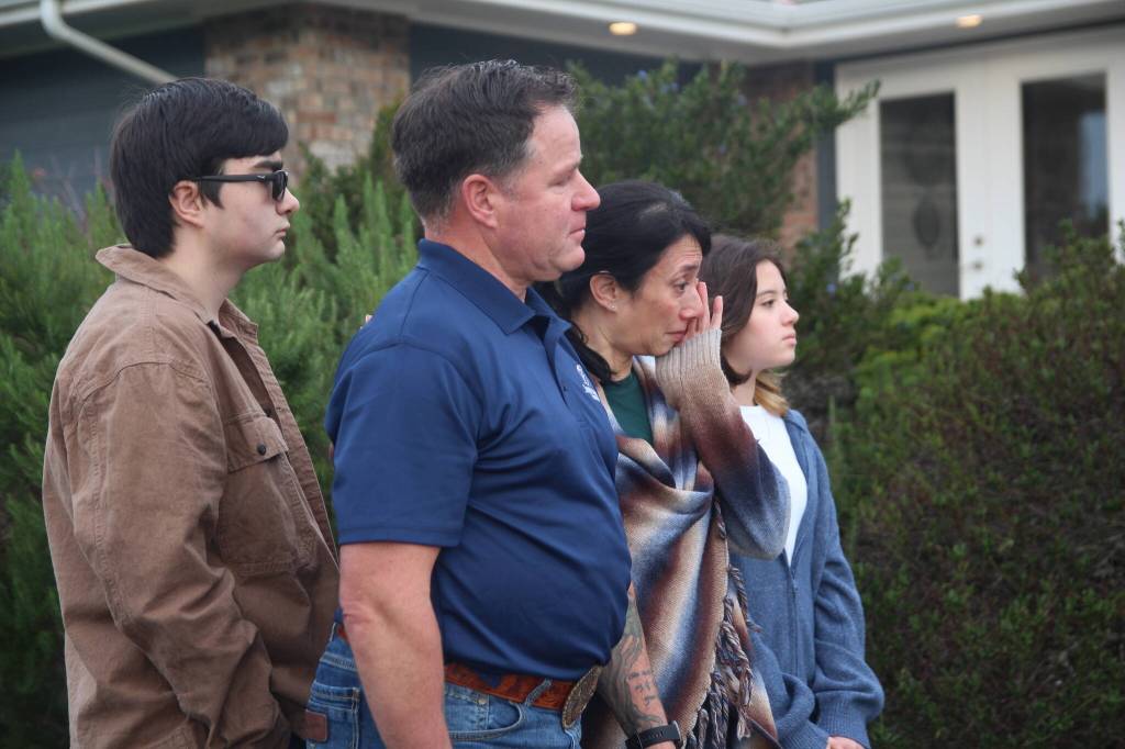 (Photo by Marina Blatt) Terry Knight and his family are overwhelmed with happy emotions as they receive their new home.