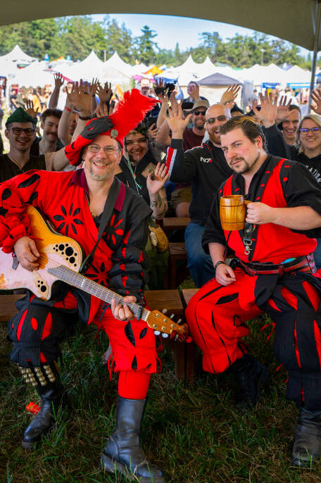 (Photo by Ted Warner Photography) People at the Ren Faire enjoy beverages music and chats with friends and strangers alike.