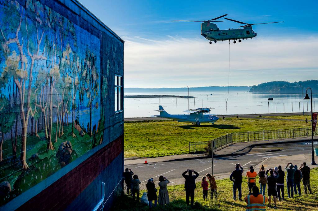 (Photo by Nathan Welton) Spectators gathered at the takeoff and touchdown points during both airlift attempts.