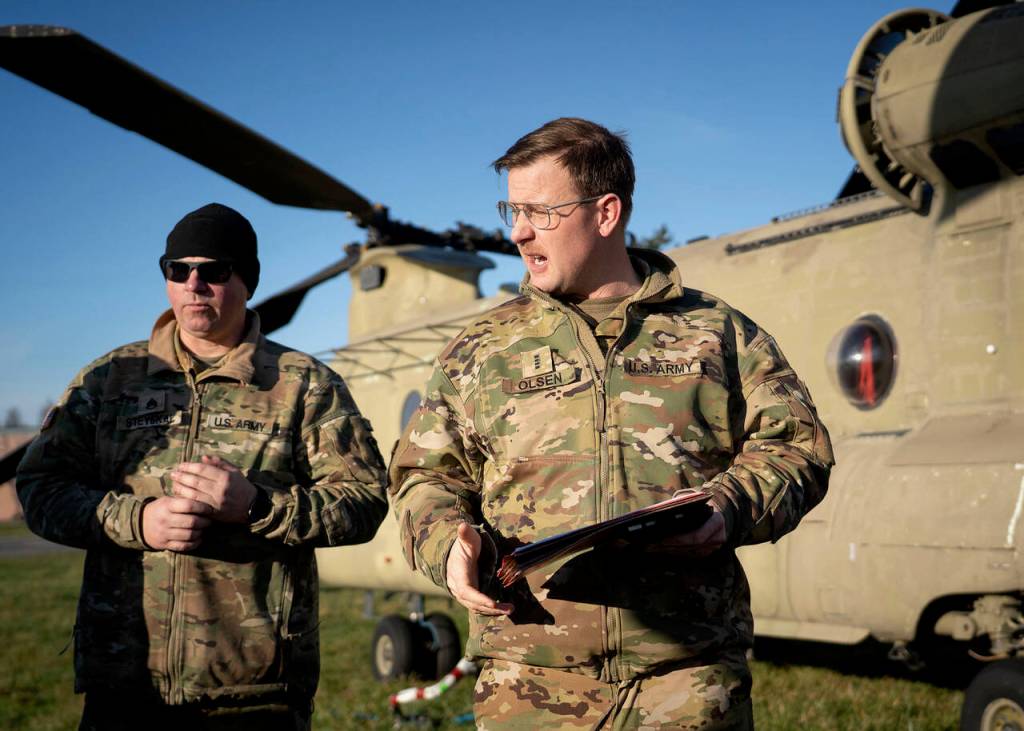 (Photo by David Welton) Chief Warrant Officer Four Crosby Olsen, pictured right, called the airlift a cool opportunity and added it is something he has never done before.