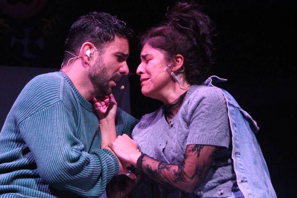 (Photo by Marina Blatt) In a desperate moment on stage, Karla Luna as Mimi Marquez and Cris Matochi as Roger Davis cling to love and each other.