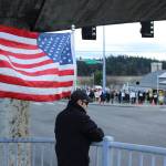 (Photo by Allyson Ballard) Demonstrators filled the sidewalks of the intersection and accumulated on the pedestrian bridge as well.