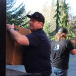 Photos by Allyson Ballard. Backbreakers NW founder Jeff Hansen, pictured in the foreground here, is a Coupeville native and the founder of the Freeland-based moving and junk removal company.