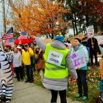 Photo by Greg Jensen. A peacekeeper directs the crowd during a protest on Whidbey. Beyond crowd safety, peacekeepers also assist participants who are overheated, injured or in need of support and coordinate with law enforcement when necessary.