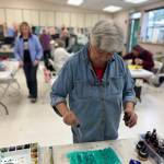 Photo by Patricia Guthrie. Create Space Langley co-founder Jackie Amatucci tests different colors of ink during the collage class she instructs at South Whidbey Community Center.