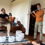 Josh Pinkston plays a handpan while accompanied by Joseph Sanchez on flute.