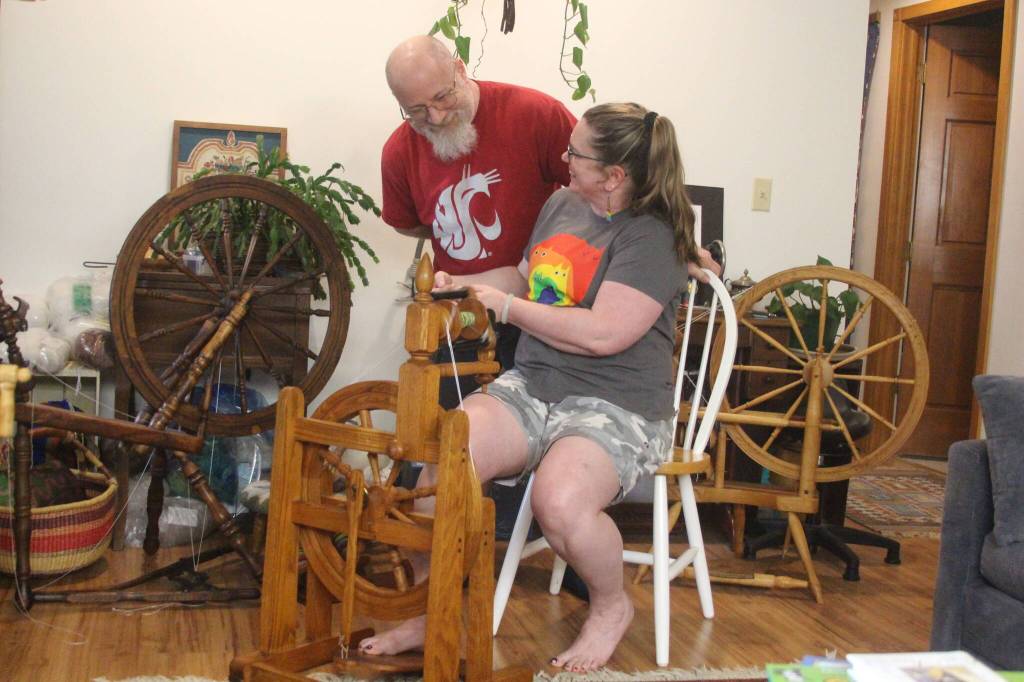 Photo by Marina Blatt. Carla McCoys connection to the spinning extends beyond organizing vendors. She loves working with wool and her husband, Jon McCoy, loves making the spinning wheels. Together, they are the perfect spinning team.