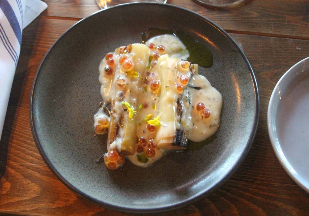 Leeks from Ralphs Greenhouse were softened with beurre blanc and dappled with roe and tarragon. The dish was paired with a 2025 Scribe Riesling, light and refreshing.