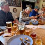 Photo by Patricia Guthrie
At a recent oyster tasting workshop hosted by Salinity Seafood & More at Thirsty Crab in Clinton, Chris Bell (left) Kip Ayers (center) and John Filicetti dig into a variety of oysters after getting shucking tips from Emily Wilder. Beers were also sampled.