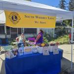 Photos provided. The South Whidbey Lions Club hosted a tulip sale recently, with the help of Mike Hill and Carolyn ODell, pictured here.