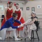 Photo by Marina Blatt. Taking center stage, 15-year-old Elena Holton squeezes into a ballet slipper in the role of Cinderella. She and the prince, 17-year-old Riley White, dazzle spectators with their acting abilities and dancing.