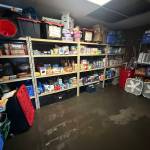 Photos provided. Although only some of the pantrys food inventory came into direct contact with the water, the damage extended beyond food supplies. Computers, business licenses, carpets and furniture throughout the rooms were ruined.