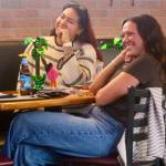 (Photo by Marina Blatt) For many young adults on Whidbey, the watch party filled a gap. With limited nightlife and few recurring social events aimed at people in their 20s and 30s, it offered a reason to leave home, meet new people and build community around a shared guilty pleasure. From left are Valentina Mendoza and Makenna Brockman.