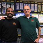 Photo by Allyson Ballard. Jonathan Crisp, left, and Marc Pendell, right, own the new Grocery Outlet in Clinton; they moved to Whidbey from the East Coast earlier this year.