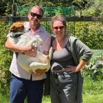 Photo by Cassandra Diamond
Ryan Woods and Nick VanDyke of South Island Pet Sitting pose with their dog Bean, whom they refer to as the camp director.