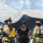 The fire destroyed the structure, which contained vehicles and welding equipment.